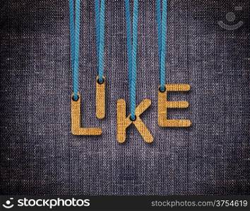 Like Letters hanging strings with blue sackcloth background.. Like