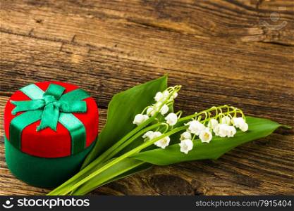 lilies of the valley on wooden background