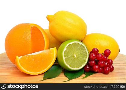 Lime, lemon, orange and cranberry with green leaves isolated on white backgrounde