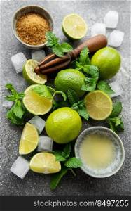 Lime, mint and ice on a dark background. The ingredients for making refreshing drinks and cocktails.