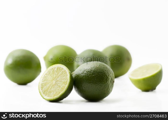 limes and halfes on white. some limes and halfes on on white background