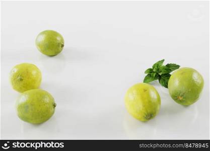 limes and lemons on white background. Citrus fruits.