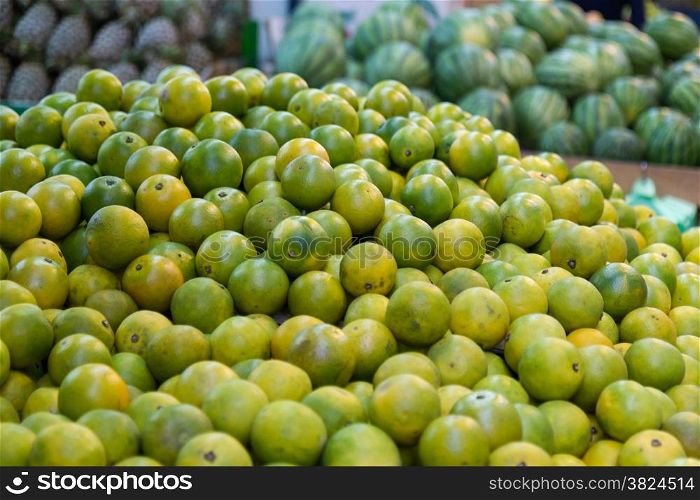 Limes at fruit stall in a traditional Taiwanese market