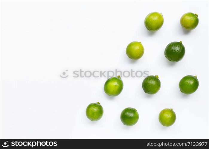 Limes isolated on white background. Top view