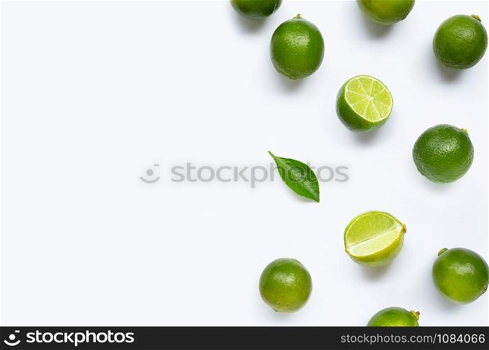 Limes with leaf isolated on white background.