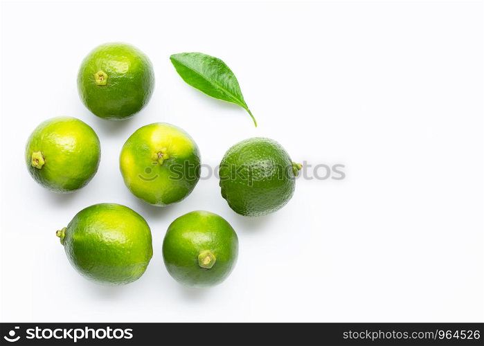 Limes with leaf isolated on white background. Copy space