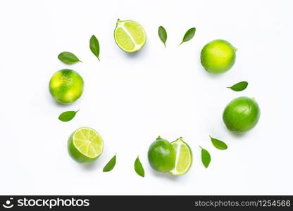 Limes with leaves isolated on white background.