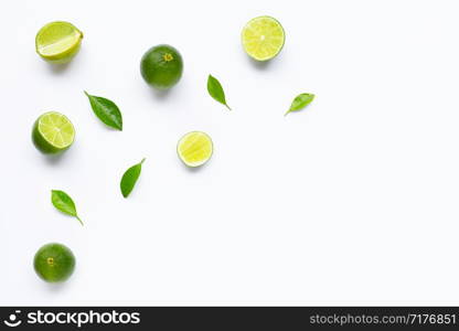 Limes with leaves isolated on white background.