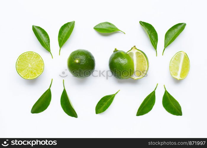 Limes with leaves isolated on white background.