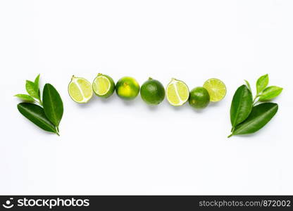 Limes with leaves isolated on white background.