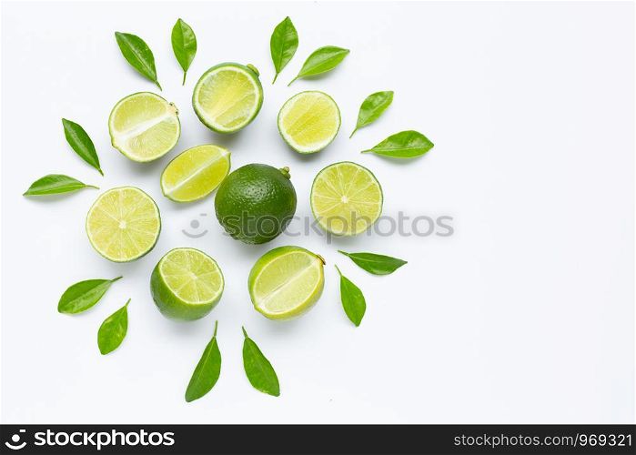 Limes with leaves isolated on white background. Copy space