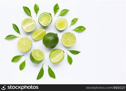 Limes with leaves isolated on white background. Copy space
