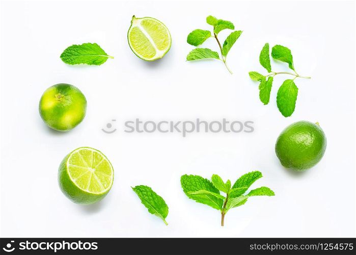 Limes with mint leaves isolated on white background. Copy space
