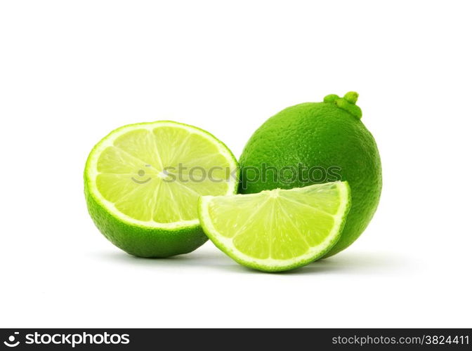 Limes with slices isolated on white background