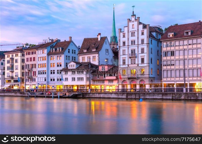 Limmat river embankment at sunset in Old Town of Zurich, the largest city in Switzerland. Zurich, the largest city in Switzerland