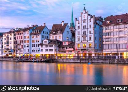 Limmat river embankment at sunset in Old Town of Zurich, the largest city in Switzerland. Zurich, the largest city in Switzerland