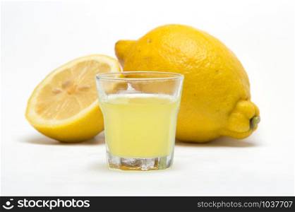 Limoncello, liqueur lemon on white background