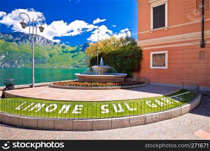 Limone sul Garda fountain and square by the lake view, town in Lago di Garda, Lombardy, Italy