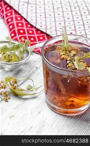 Linden herbal tea. glass of tea brewed with therapeutic Linden