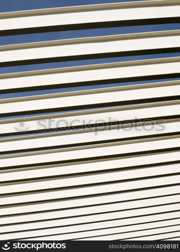 Line abstract from a ceiling of a covering structure.