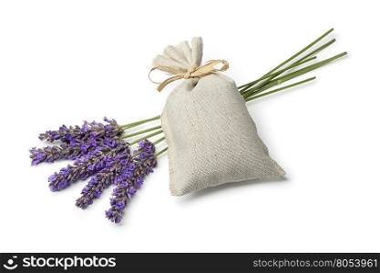 Linen sack with dried lavender flowers and fresh lavender on white background