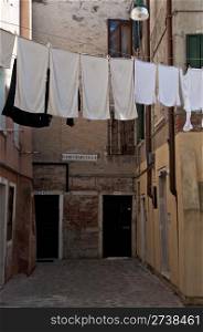Linens and clothes dries outdoor. Venice street, Italy