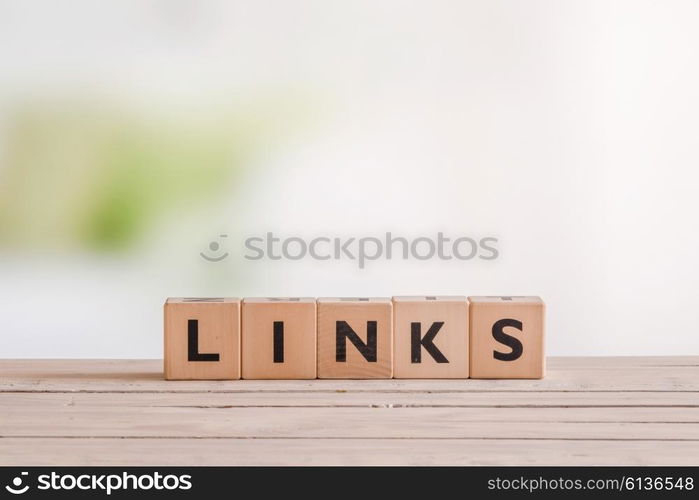 Links sign standing on a wooden desk