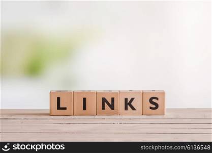 Links sign standing on a wooden desk