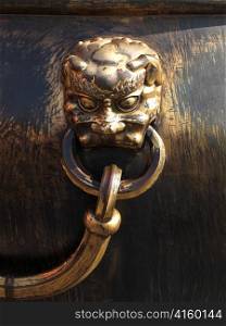 Lion handle on a bronze urn at the Forbidden City, Beijing, China