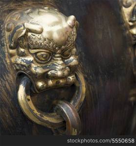 Lion handle on a bronze urn at the Forbidden City, Xicheng District, Beijing, China