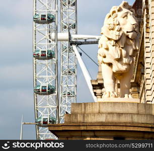 lion london eye in the spring sky and white clouds