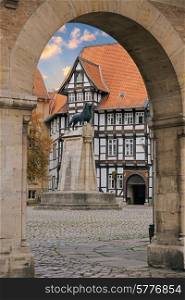 Lion statue and old timbered house in Braunschweig patio, Germany&#xA;