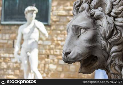 Lion statue stands at the entrance of the Loggia dei Lanzi in Piazza della Signoria in Florence