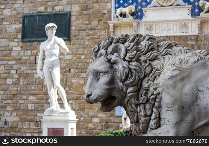 Lion statue stands at the entrance of the Loggia dei Lanzi in Piazza della Signoria in Florence