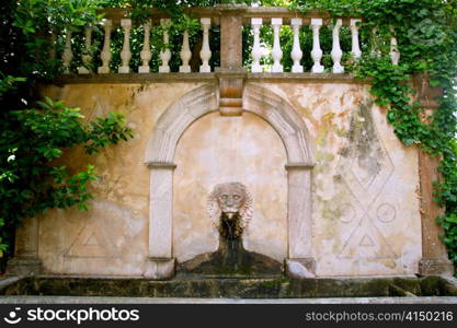 Lion stone sculpture fountain in Son Marroig at Deia Mallorca