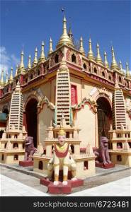 Lions on the corner of temple in Mohnyin Thambuddhei Paya , Moniwa, Myanmar