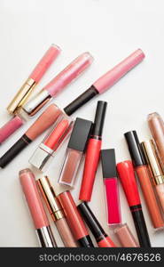 lip gloss in assortiment around white backround