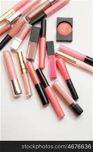 lipgloss in assortiment around white backround