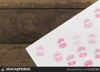 lipstick kisses paper wooden board