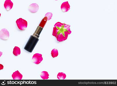 Lipstick with rose petals isolated on white background. Beautiful Make-up concept