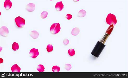Lipstick with rose petals isolated on white background. Beautiful Make-up concept