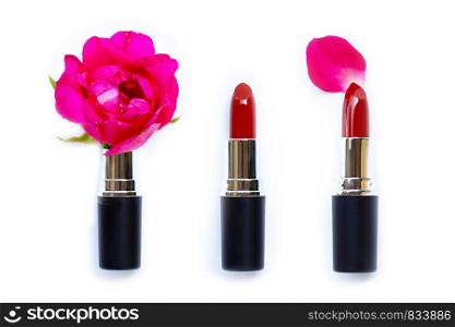 Lipsticks with rose flower on over white background. Beautiful Make-up concept