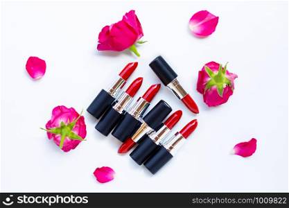 Lipsticks with rose flower on white background.. Beautiful Make-up concept