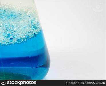 Liquid blue in container on a white background