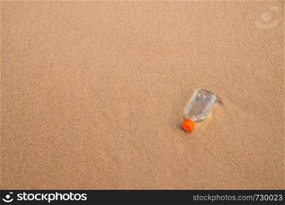 liquor bottle on a beach