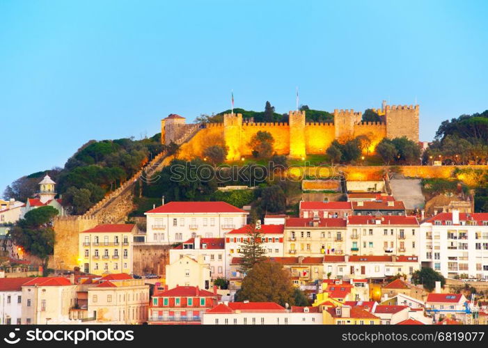 Lisbon Castle on a top of a hill at twilight. Lisbon, Portugal
