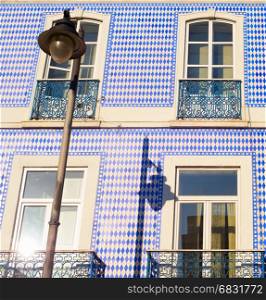 Lisbon house wall wtih traditional Portuguese tile at sunset
