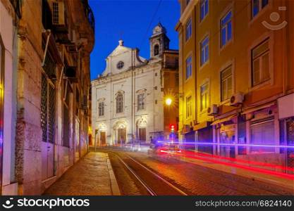 Lisbon. Old street at night.. Traditional old street in the night illuminated with tram tracks in Lisbon. Alfama district. Portugal.