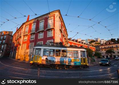 LISBON, PORTUGAL - MAY 3, 2017: Traditional yellow tram running at old streets of Lisbon, Portugal