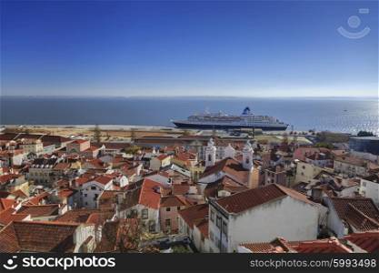 Lisbon roofs and cruise ship in harbor, top view&#xA;